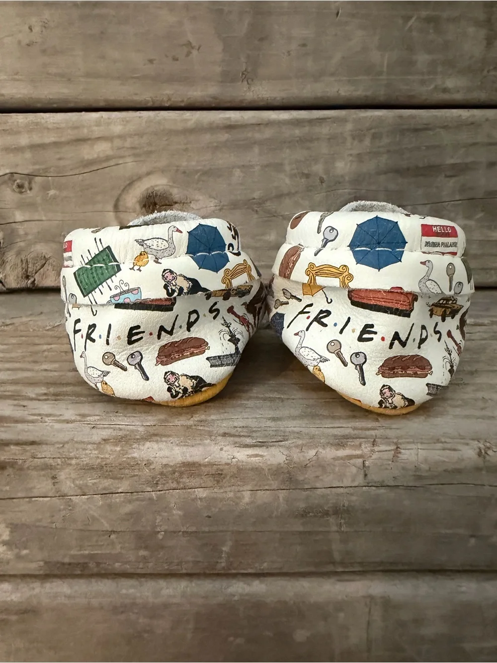 Freshly Picked “Friends” White Baby Moccasins with Multicolor Home Icons